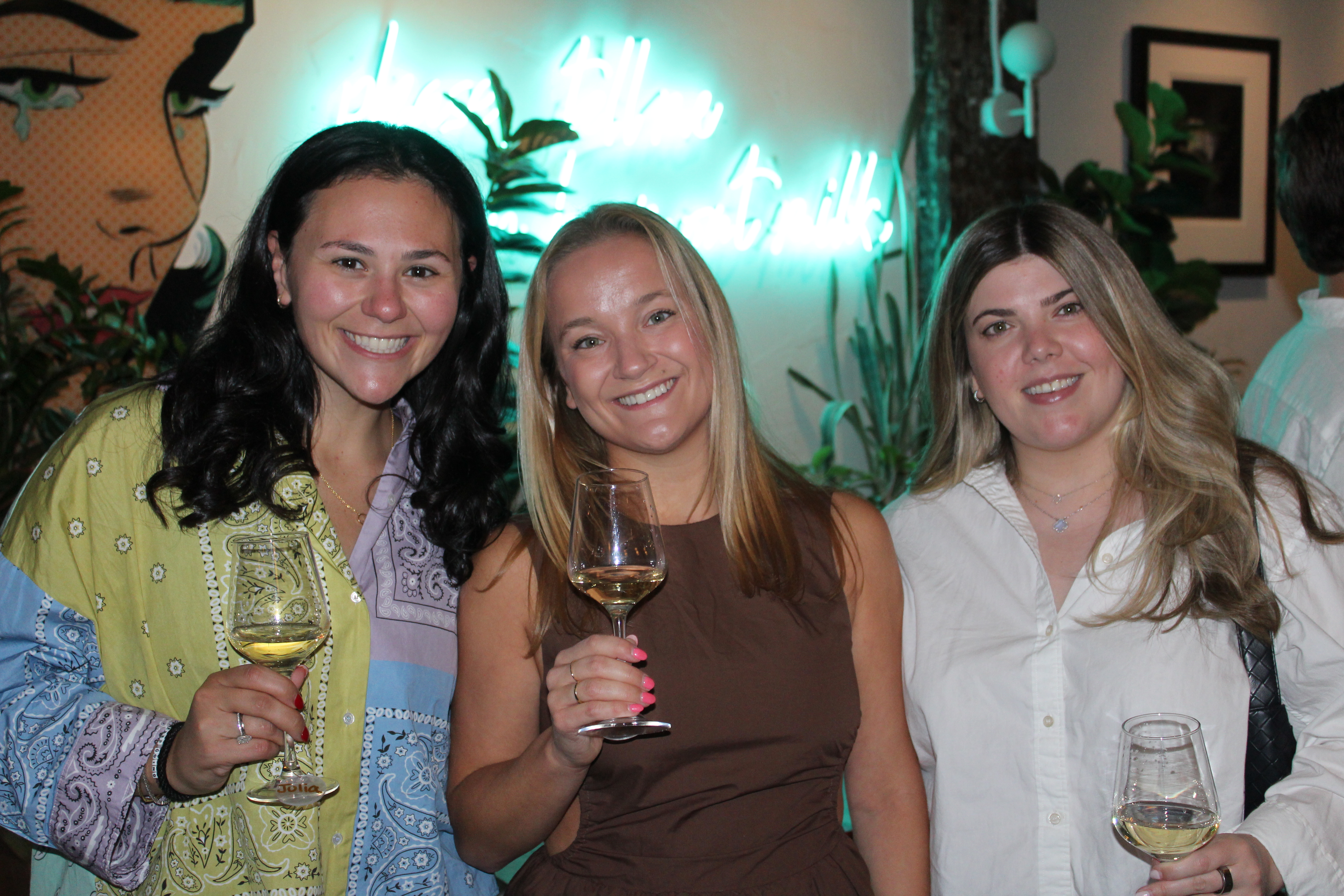 Friends sharing wine at a Sips event