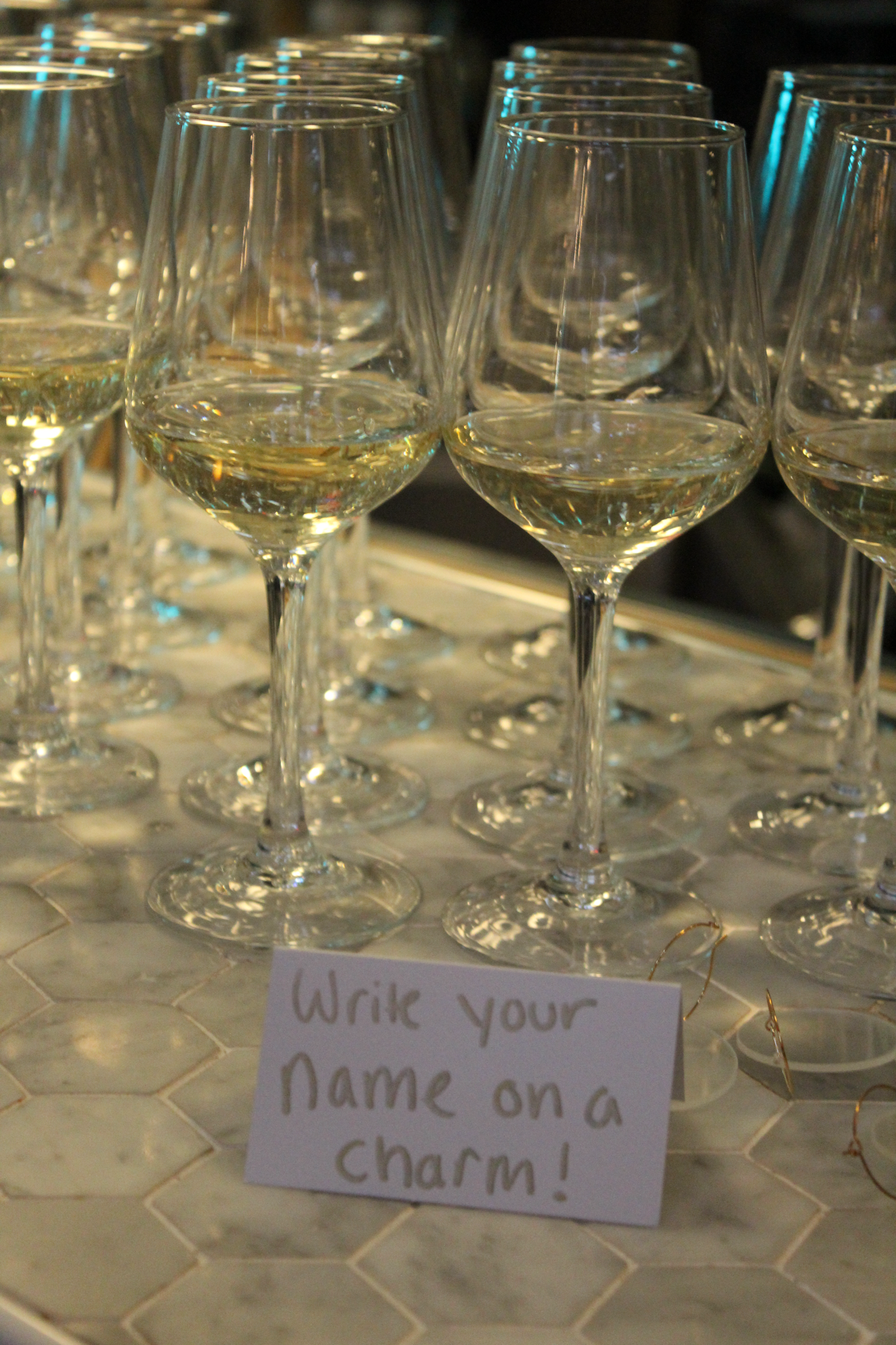 Glasses and charms laid out for a Sips tasting
